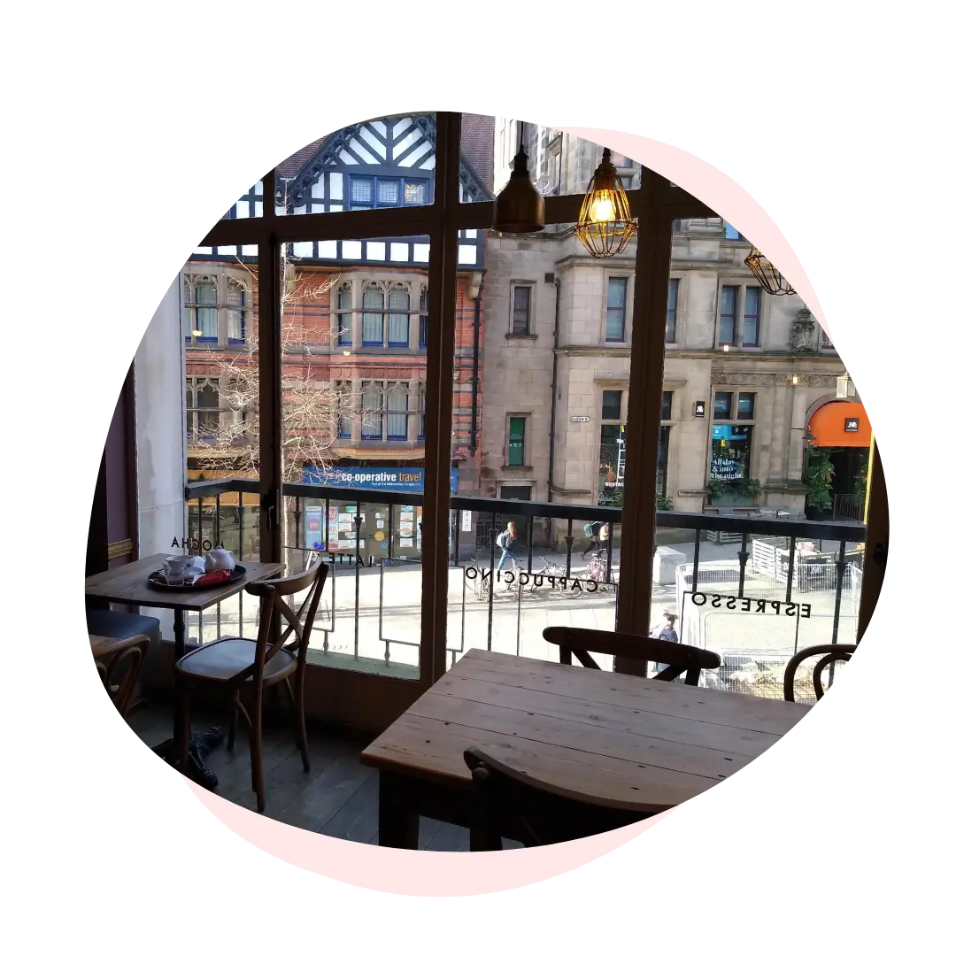 Interior photo of a cafe looking out over the street in Nottingham